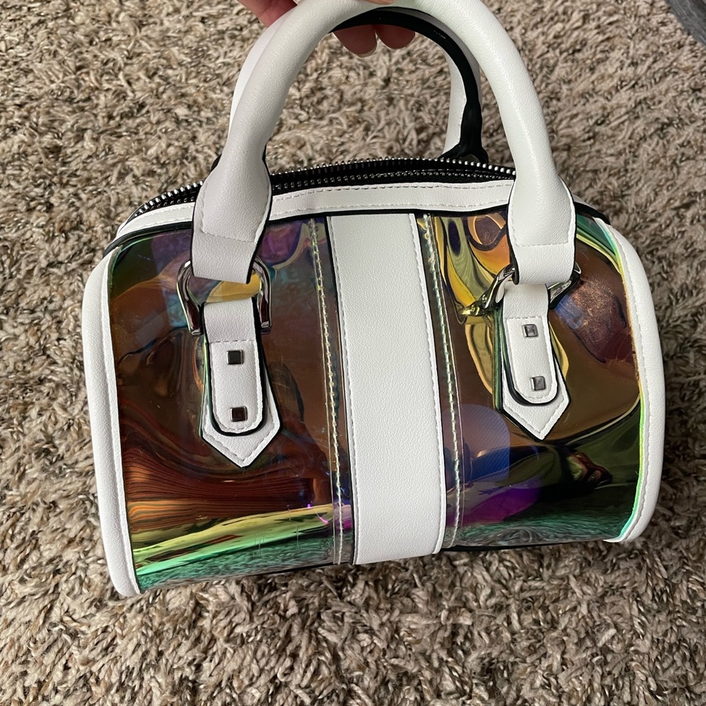 Multicolor holographic small purse with attached strap to create a crossbody bag